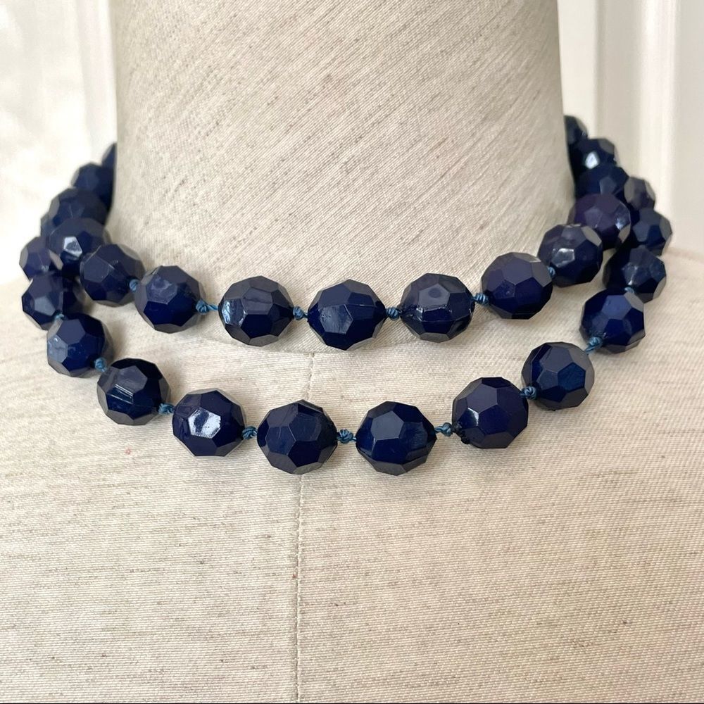 Long dark blue beaded necklace